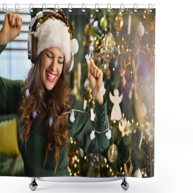 Personality  Christmas Time. Smiling Modern 40 Years Old Housewife In Green Dress Listening To The Music With Headphones And Dancing Near Christmas Tree In The Modern House. Shower Curtains