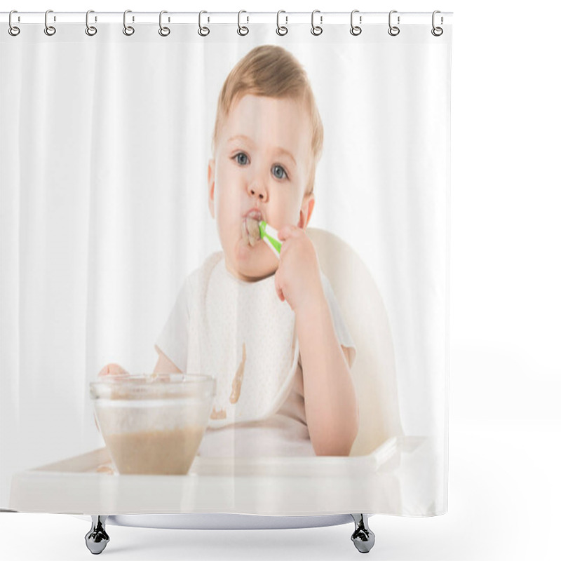 Personality  Little Boy In Bib Eating Porridge By Spoon And Sitting In Highchair Isolated On White Background  Shower Curtains