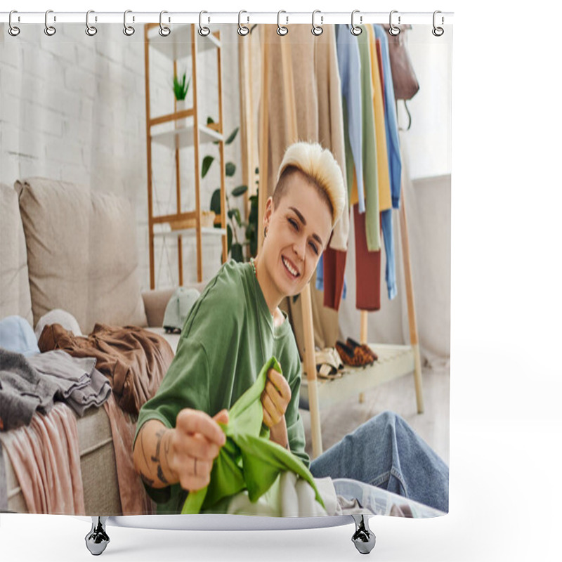 Personality  Young Excited Woman Sorting Second-hand Clothes And Holding Green Garment Near Couch And Rack At Home, Trendy Hairstyle, Tattoo, Looking At Camera, Sustainable Living And Mindful Consumerism Concept Shower Curtains