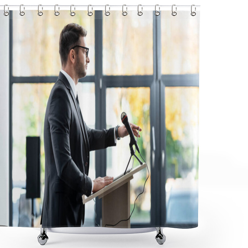 Personality  Side View Of Businessman In Suit Standing At Podium Tribune And Looking Away During Conference Shower Curtains