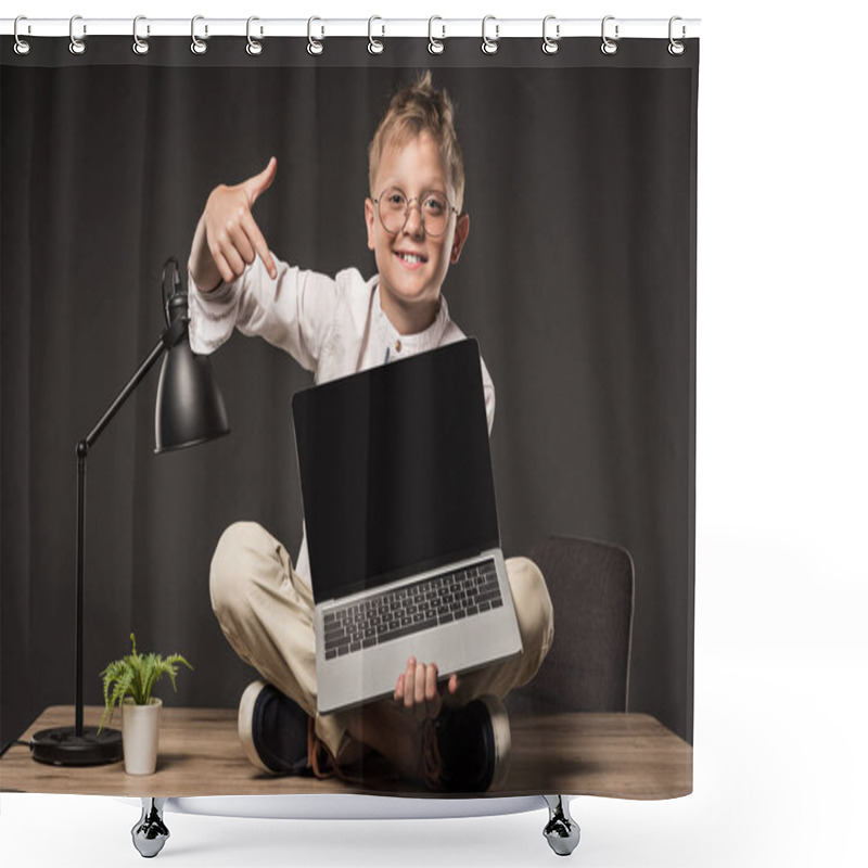 Personality  Smiling Little Boy In Eyeglasses Sitting On Table And Pointing On Laptop With Blank Screen On Grey Background  Shower Curtains