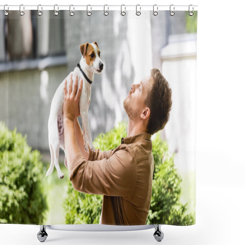 Personality  Young Man Standing Outdoors And Raising Jack Russell Terrier Dog On Hands Shower Curtains