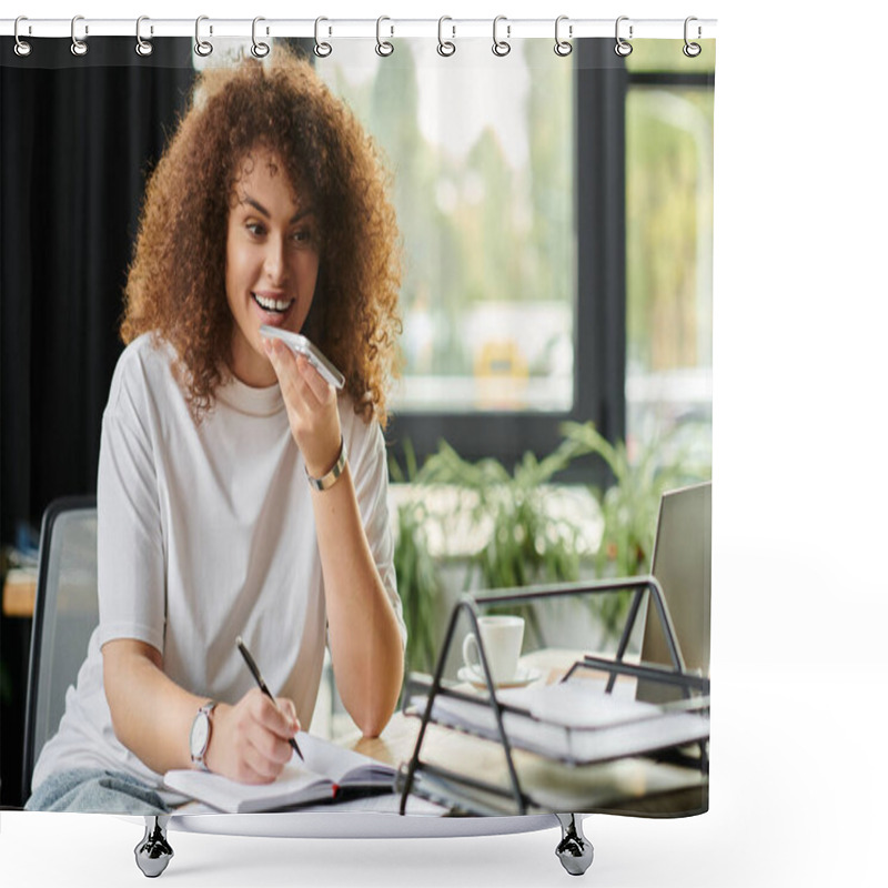 Personality  A Cheerful Woman Is Busy Taking Notes While On A Phone Call In A Modern Workspace. Shower Curtains