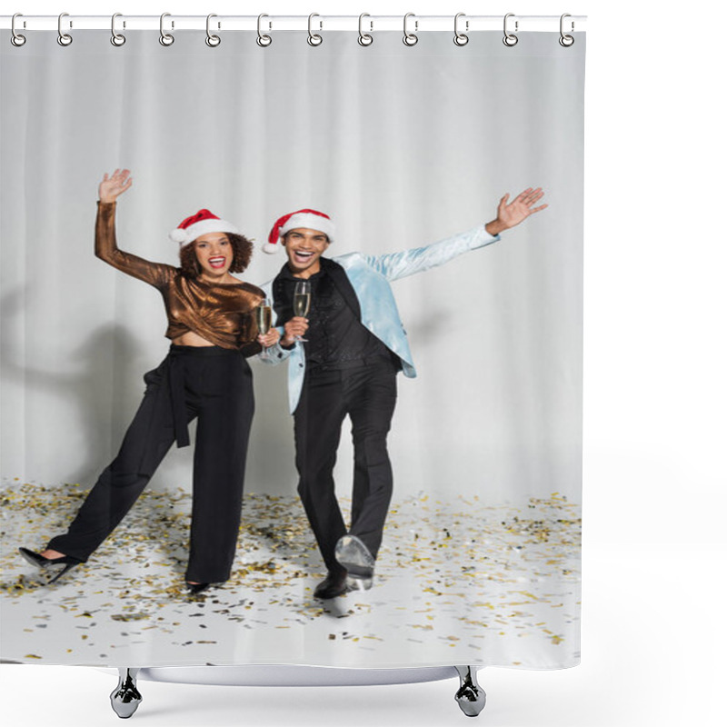 Personality  Excited And Elegant African American Couple In Santa Hats Holding Champagne And Waving Hands On Grey Background Shower Curtains