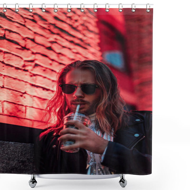 Personality  Handsome Young Man In Sunglasses And Leather Jacket Drinking Take Away Cocktail From Plastic Cup Under Red Light On Street Shower Curtains