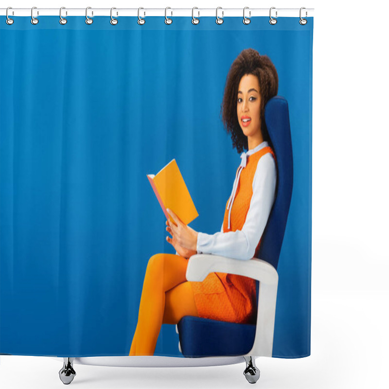 Personality  Smiling African American In Retro Dress Holding Book And Sitting On Seat Isolated On Blue  Shower Curtains