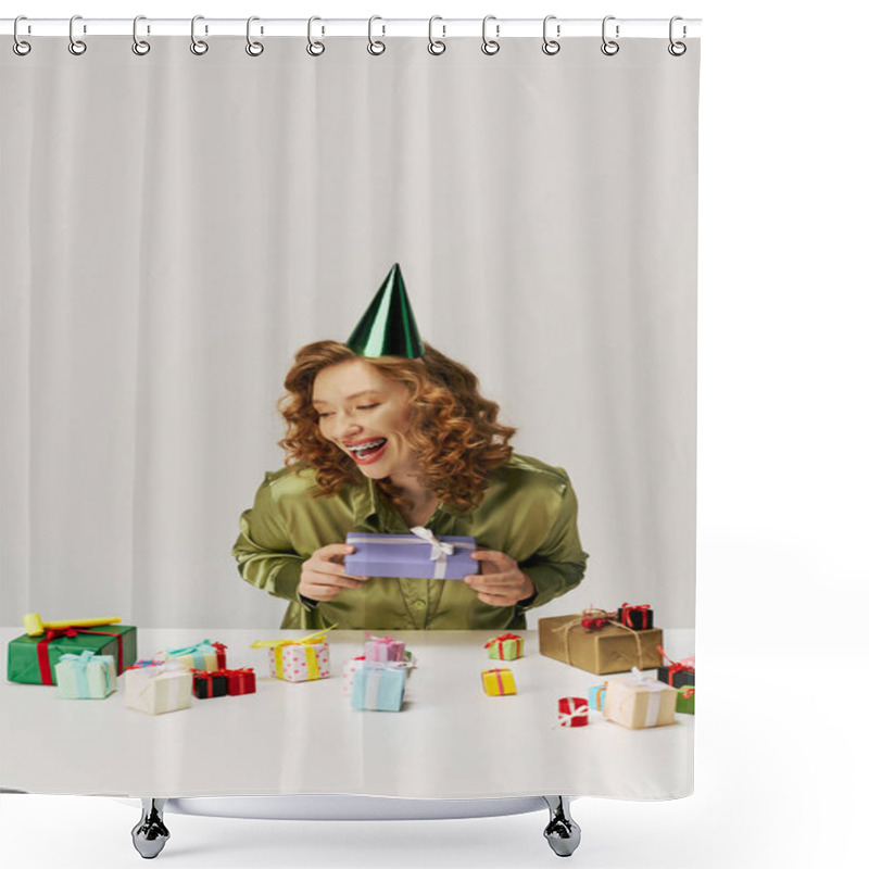 Personality  A Young Woman With Curly Hair Smiles As She Unwraps A Beautifully Wrapped Gift Surrounded By Others. Shower Curtains