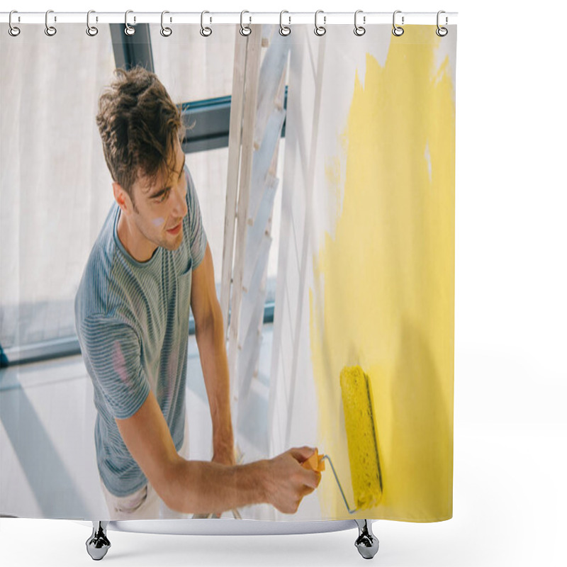 Personality  High Angle View Of Handsome Young Man Painting Wall In Yellow With Paint Roller Shower Curtains