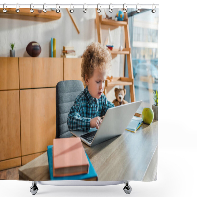 Personality  Selective Focus Of Curly Kid Typing On Laptop Near Books  Shower Curtains