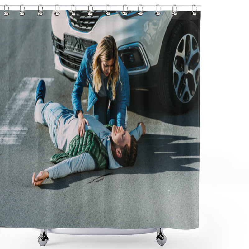 Personality  High Angle View Of Scared Young Woman Touching Injured Man Lying On Road After Car Accident Shower Curtains