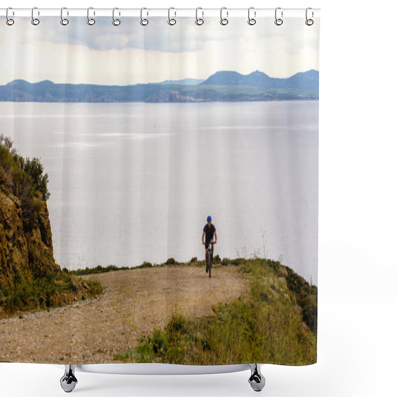 Personality  Theme Tourism And Cycling On Mountain Biking. Guy Rides Uphill On A Rocky, Rocky Road Against The Background Of The Mediterranean Sea In Spain On The Shore Of The Kosta Brava In Helmet And Sportswear Shower Curtains