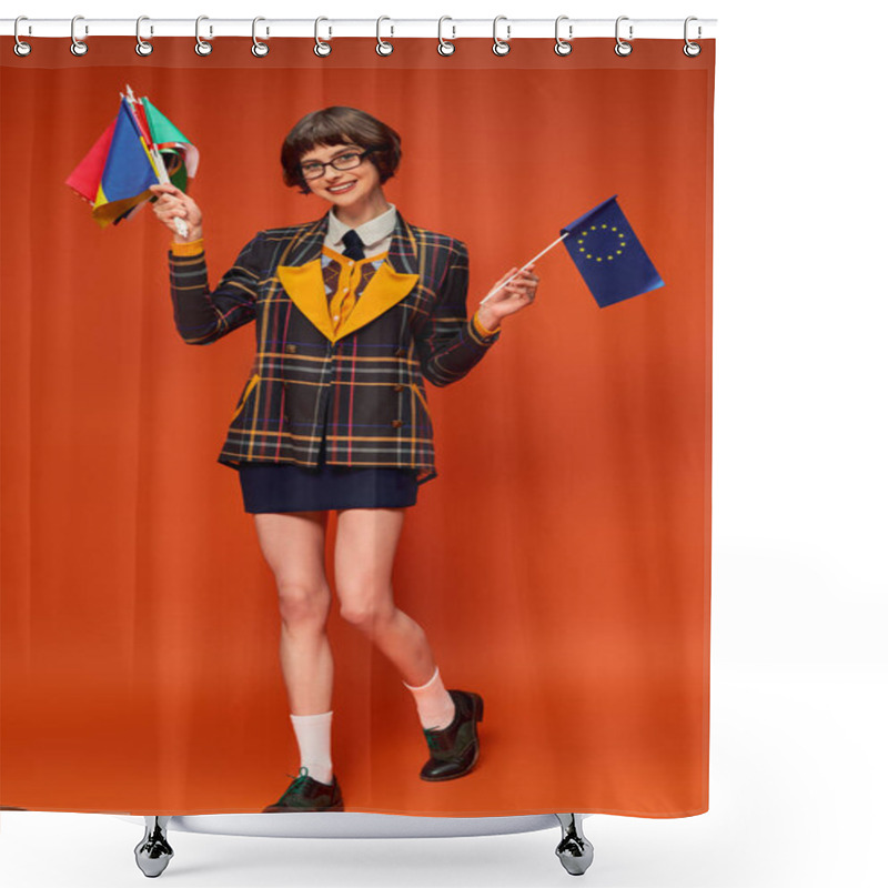 Personality  Happy Young College Girl In Uniform And Glasses Holding EU And Different Flags On Orange Background Shower Curtains