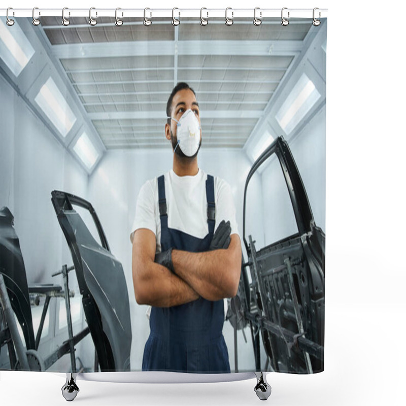 Personality  A Young Mechanic In A Mask Stands With Arms Crossed In A Busy Auto Workshop. Shower Curtains