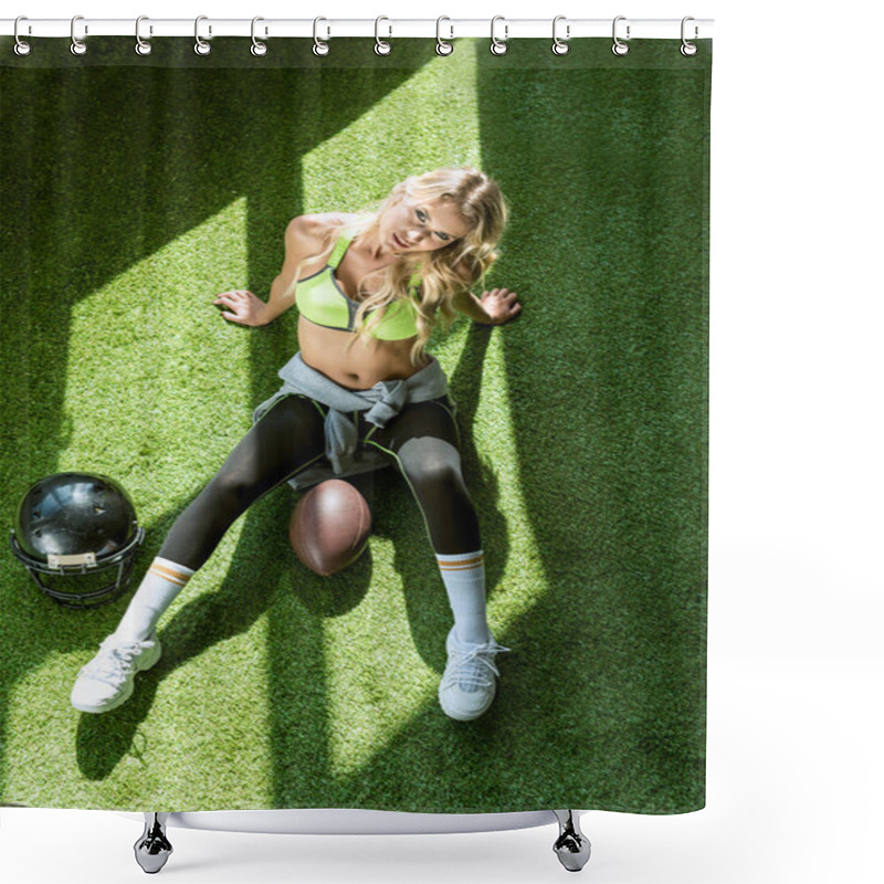 Personality  Overhead View Of Sporty Young Woman Sitting On Green Grass With American Football Ball And Helmet Shower Curtains