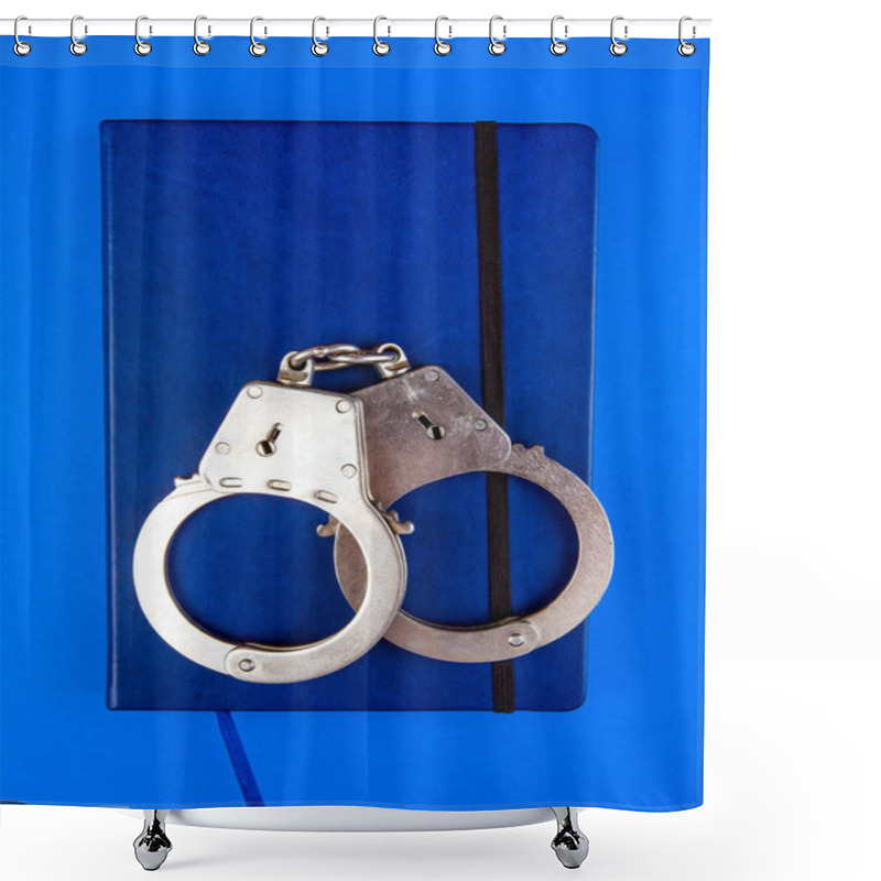 Personality  Book And A Handcuffs On The Blue Paper Background Closeup Shower Curtains