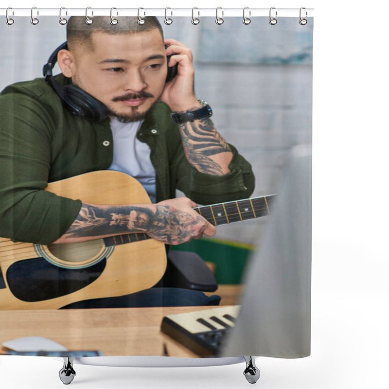 Personality  A Tattooed Asian Man In Casual Clothing Plays An Acoustic Guitar While Wearing Headphones In His Home Recording Studio. Shower Curtains