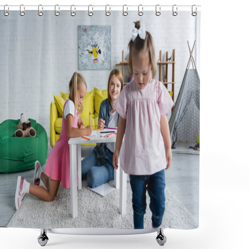 Personality  Smiling Kindergarten Teacher Looking At Blurred Kid With Down Syndrome Walking In Playroom  Shower Curtains