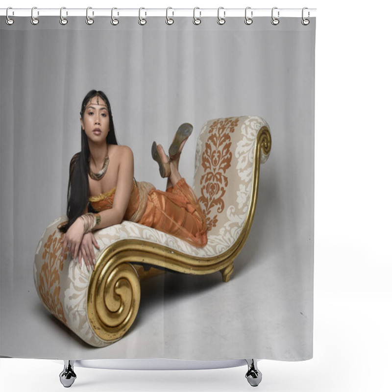 Personality  Full Length Portrait Of Pretty Young Asian Woman Wearing Golden Arabian Robes Like A Genie, Seated Pose On Lounge, Isolated On Studio Background. Shower Curtains