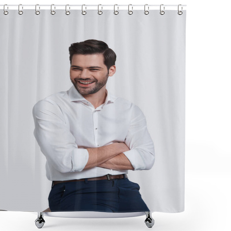 Personality  Cheerful And Handsome Man Keeping Arms Crossed And Looking Away While Sitting Against Grey Background Shower Curtains