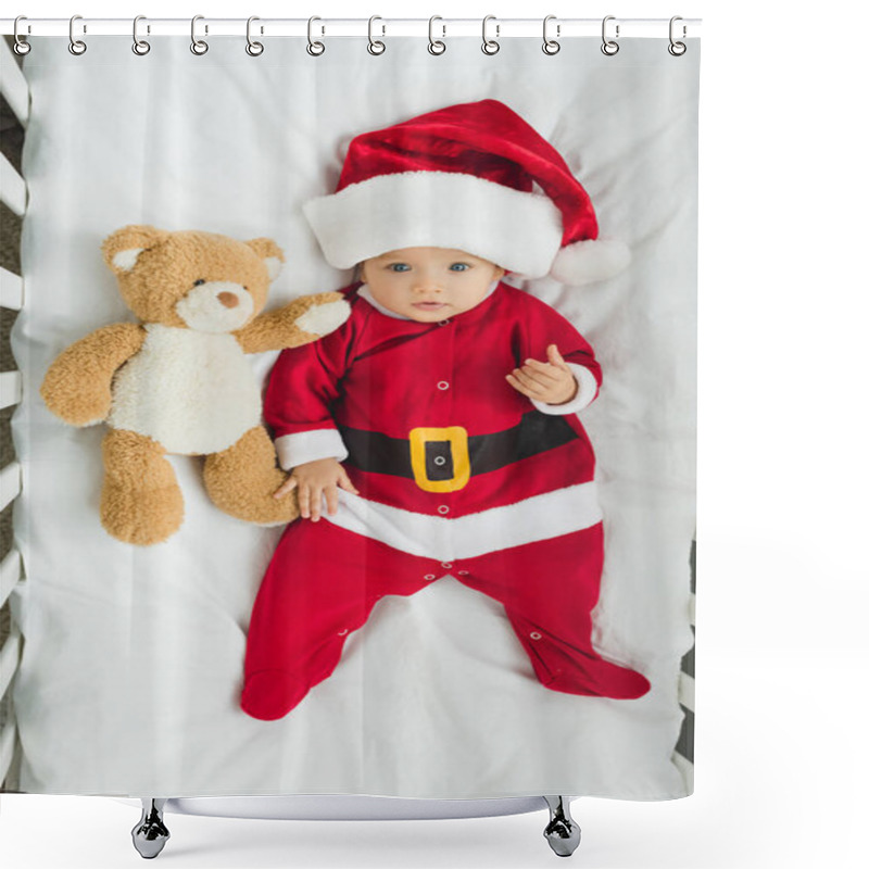 Personality  Top View Of Cute Little Baby In Santa Suit Lying In Crib With Teddy Bear And Looking At Camera Shower Curtains