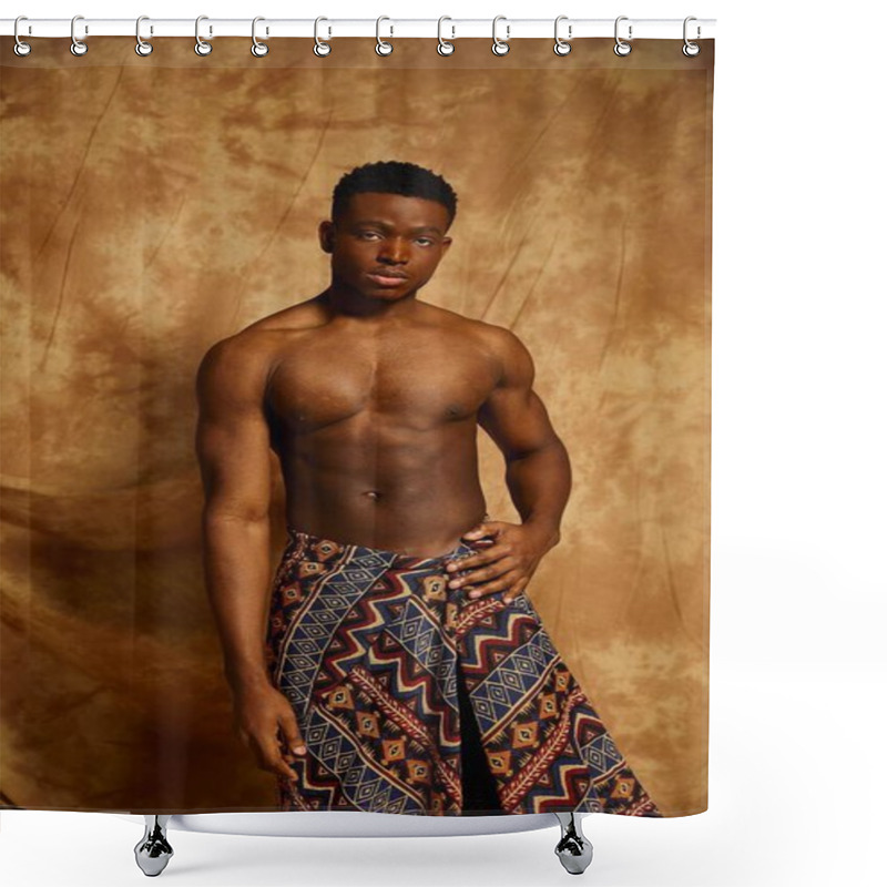 Personality  A Young Confident Man Stands Shirtless, Showcasing His Toned Physique. He Wears A Patterned Wrap That Adds A Cultural Touch. The Warm Toned Backdrop Enhances The Artistic Vibe Of The Moment. Shower Curtains