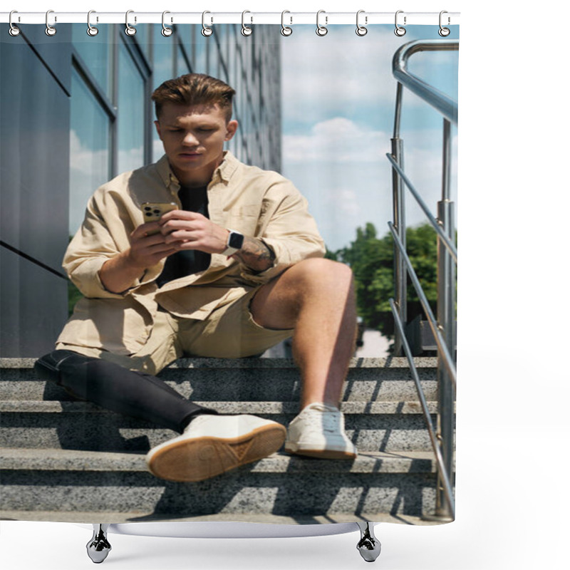 Personality  A Dedicated Young Man Using His Smartphone While Seated On Stairs In A Contemporary Office Environment. Shower Curtains