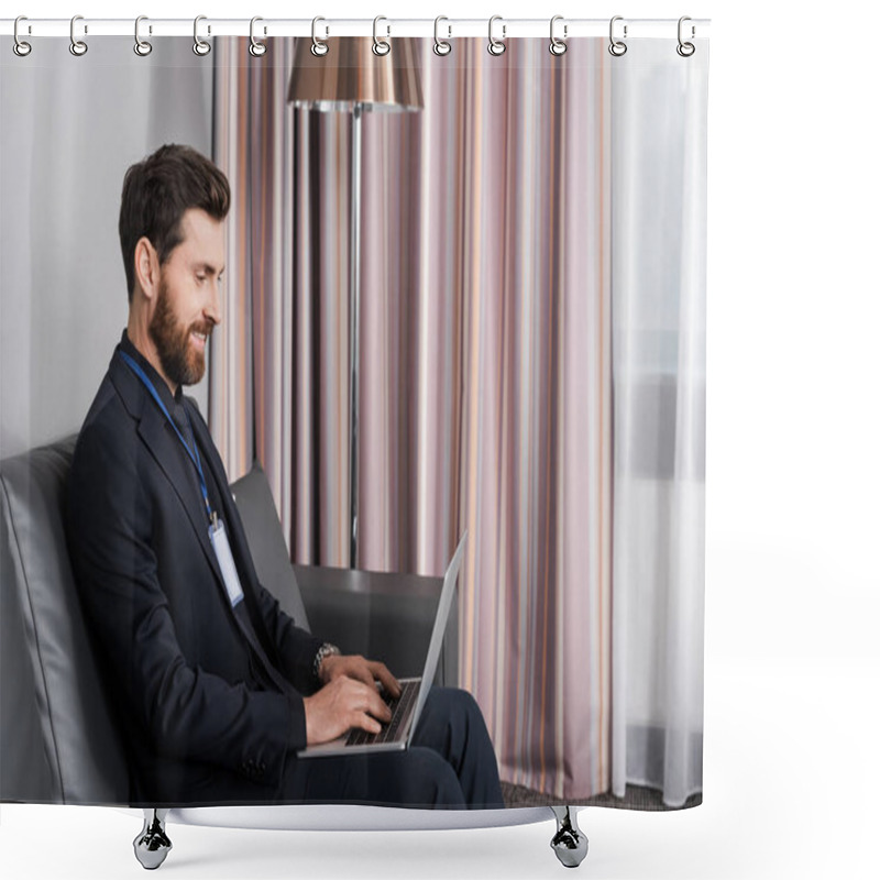 Personality  Joyful Businessman With Id Badge Using Laptop While Sitting On Leather Couch In Hotel Room Shower Curtains