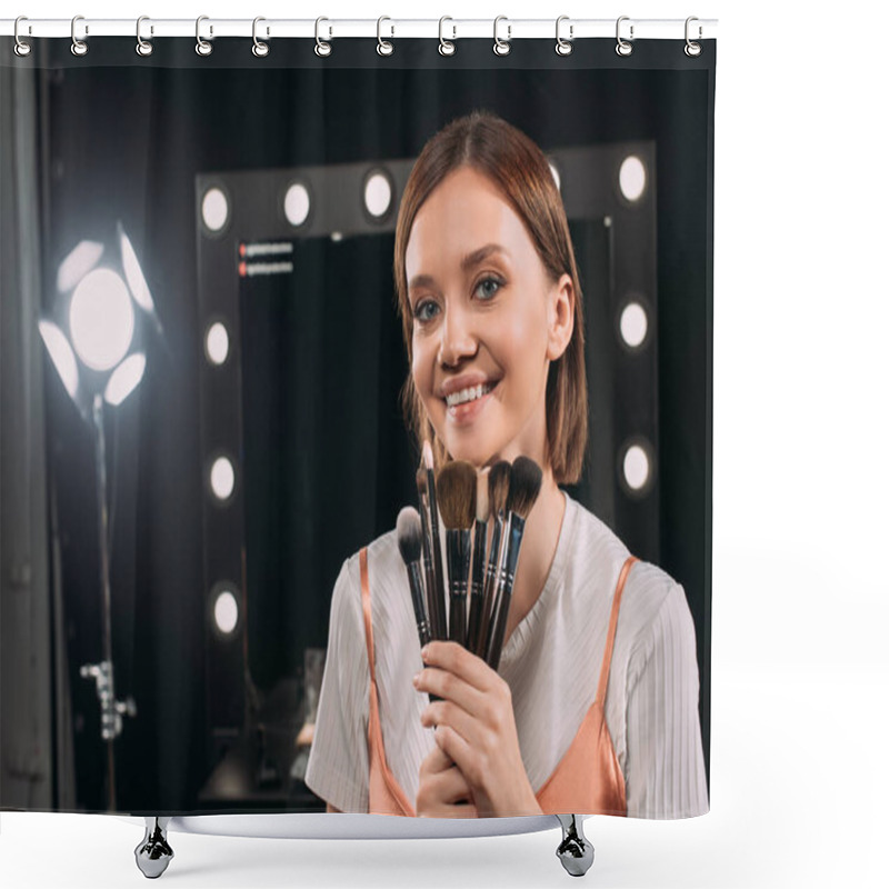 Personality  Beautiful Model Smiling At Camera While Holding Cosmetic Brushes In Photo Studio  Shower Curtains