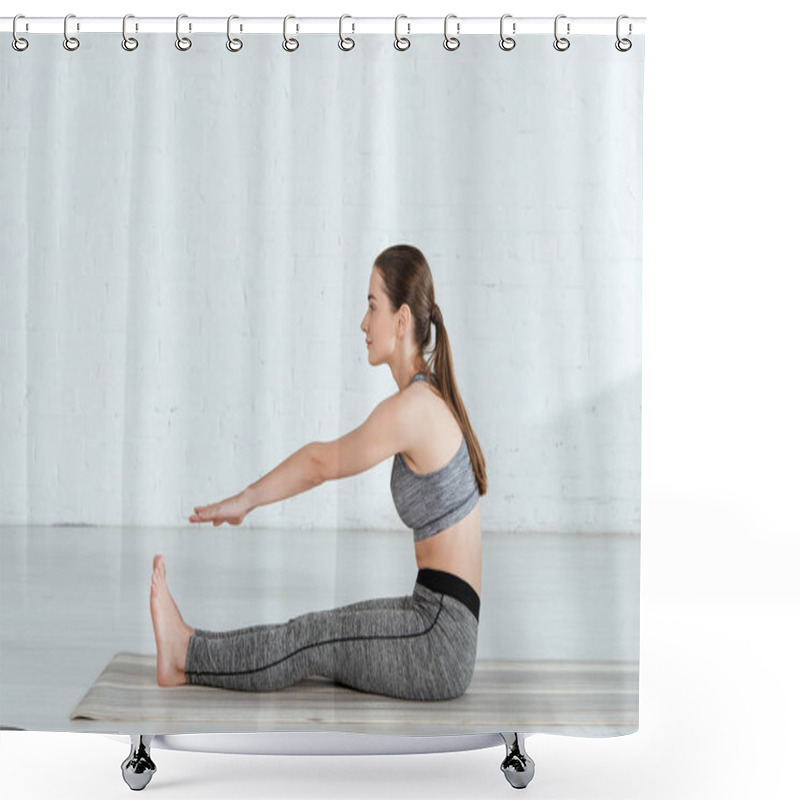 Personality  Side View Of Young Woman In Sportswear Practicing Yoga In Seated Forward Bend Pose  Shower Curtains