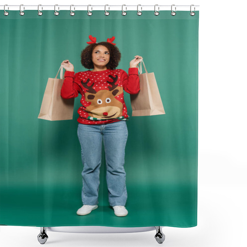 Personality  Smiling And Dreamy African American Woman In Christmas Outfit Holding Shopping Bags And Looking Away On Green Background Shower Curtains