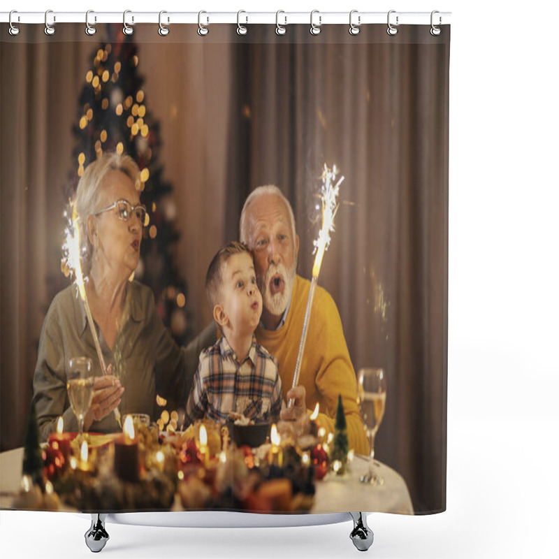 Personality  Senior Couple Is Having Fun With Grandchild Celebrating Christmas And New Year's Eve With Fireworks At Table At Home. Shower Curtains