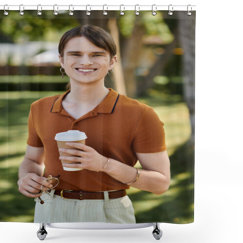 Personality  A Young Non Binary Person Smiles While Holding A Coffee Cup, Surrounded By Greenery. Shower Curtains