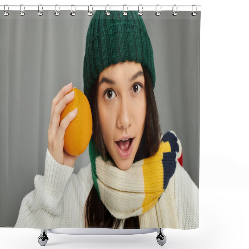 Personality  This Cheerful Young Woman Expresses Surprise While Holding An Orange, Dressed Warmly For Winter. Shower Curtains