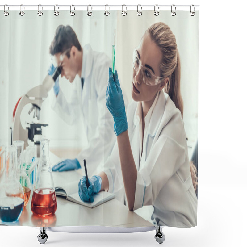 Personality  Young Scientists Examining Samples In Laboratory. Female Researcher Looking At Chemical Liquid Samples In Flasks While Male Scientist Using Microscope. Scientists At Work In Laboratory Shower Curtains