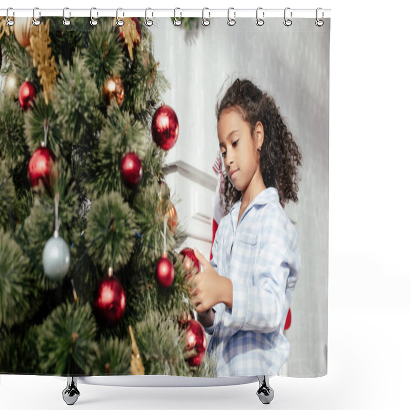 Personality  Adorable African American Child In Pajamas Decorating Christmas Tree With Red Balls At Home Shower Curtains