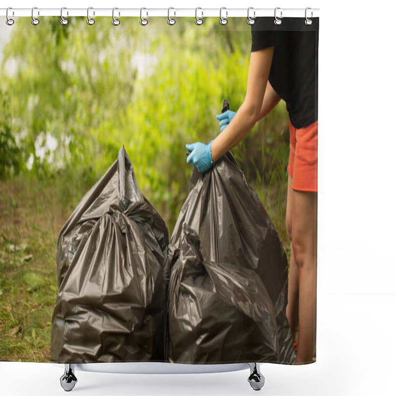 Personality  People Collect Garbage In Bags. Hands Tie A Bag. Collect Garbage In Nature. The Concept Of Cleaning In Nature. Clean The Green Area. Collect Garbage In Gloves. Black Bags. Trash  Shower Curtains