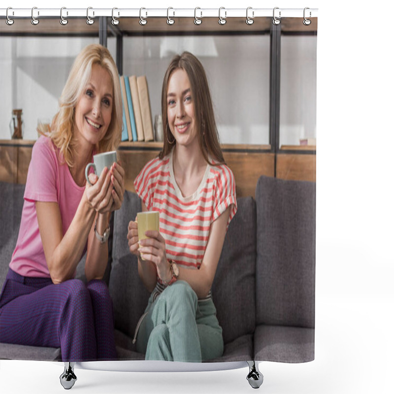 Personality  Cheerful Mother And Daughter Looking At Camera While Sitting On Sofa And Holding Tea Cups Shower Curtains