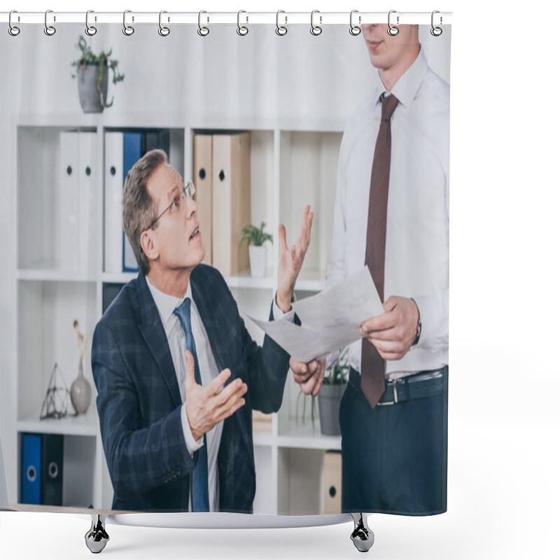 Personality  Middle Aged Dissatisfied Businessman Sitting At Table And Talking With Worker Standing Near With Documents In Office, Compensation Concept Shower Curtains