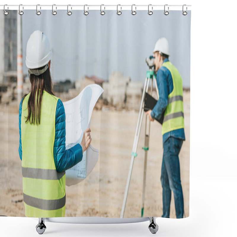 Personality  Selective Focus Of Surveyor With Blueprint And Colleague Using Digital Level On Construction Site Shower Curtains