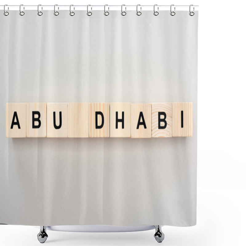 Personality  Top View Of Wooden Blocks With Abu Dhabi Lettering On Grey Background Shower Curtains