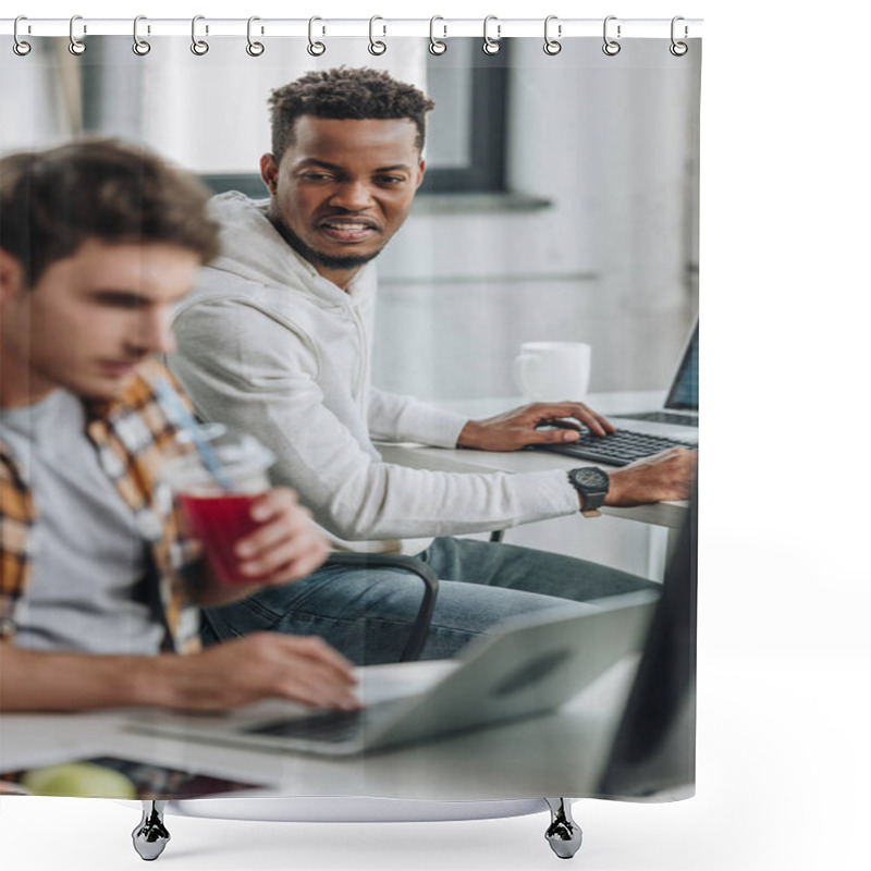 Personality  Selective Focus Of Angry African American Programmer Looking At Colleague Drinking Juice Shower Curtains