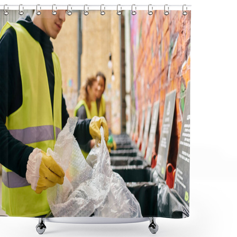 Personality  A Young Man In A Yellow Vest Cleans Up Trash With Other Volunteers, Promoting Environmental Consciousness. Shower Curtains