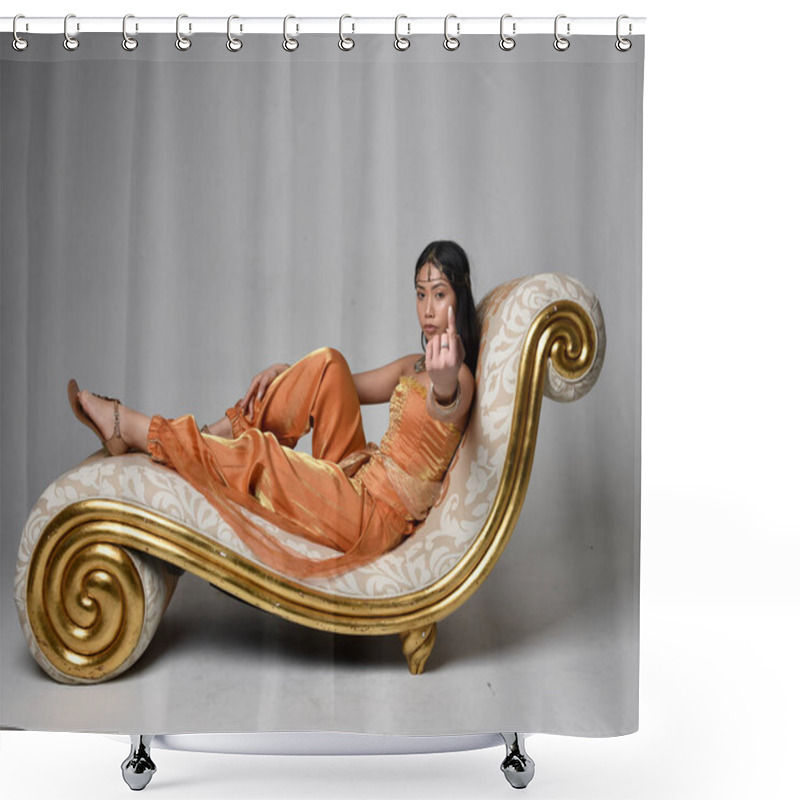 Personality  Full Length Portrait Of Pretty Young Asian Woman Wearing Golden Arabian Robes Like A Genie, Seated Pose On Lounge, Isolated On Studio Background. Shower Curtains