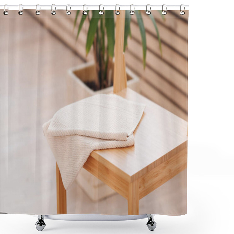 Personality  Natural Beige Towel Folded On Wooden Bathroom Table. Elements Of Bathroom Decor Using Natural Materials. Minimalism In Renovation Shower Curtains