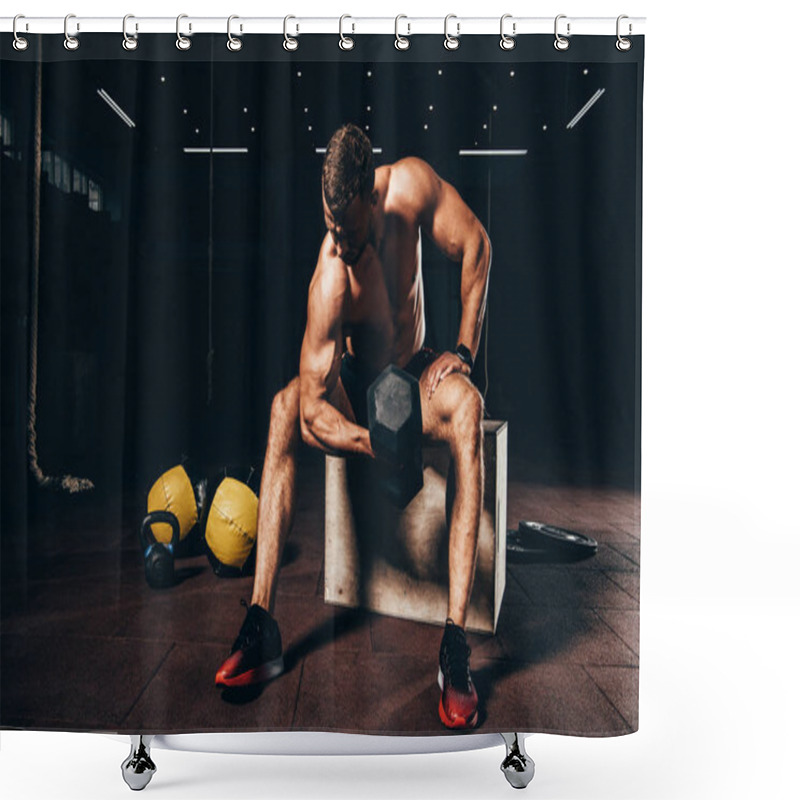 Personality  Handsome Muscular Sportsman Lifting Dumbbell While Sitting On Cube In Dark Gym Shower Curtains