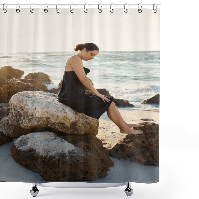 Personality  Young Woman In Black Sundress Sits On A Rock By The Ocean At Sunset, With Sun Casting A Golden Light. Shower Curtains