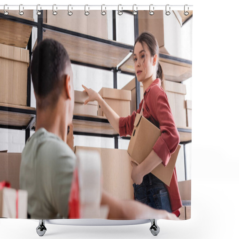 Personality  Young Seller Holding Carton Box Near Blurred African American Colleague In Online Web Store  Shower Curtains