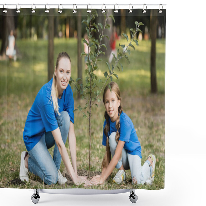 Personality  Smiling Mother And Daughter Looking At Camera While Planting Young Tree In Park, Ecology Concept Shower Curtains