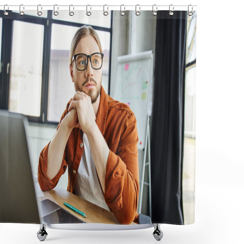 Personality  Stylish And Pensive Businessman In Eyeglasses And Trendy Casual Clothes Looking Away Near Laptop And Pen On Work Desk Next To Flip Chart With Graphs On Blurred Background In Modern Office Shower Curtains