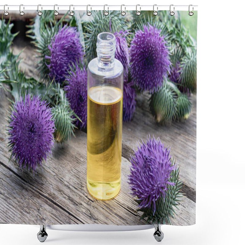 Personality  Bottle Of Thistle Essential Oil With Thistle Flowers On Wooden Background. Shower Curtains